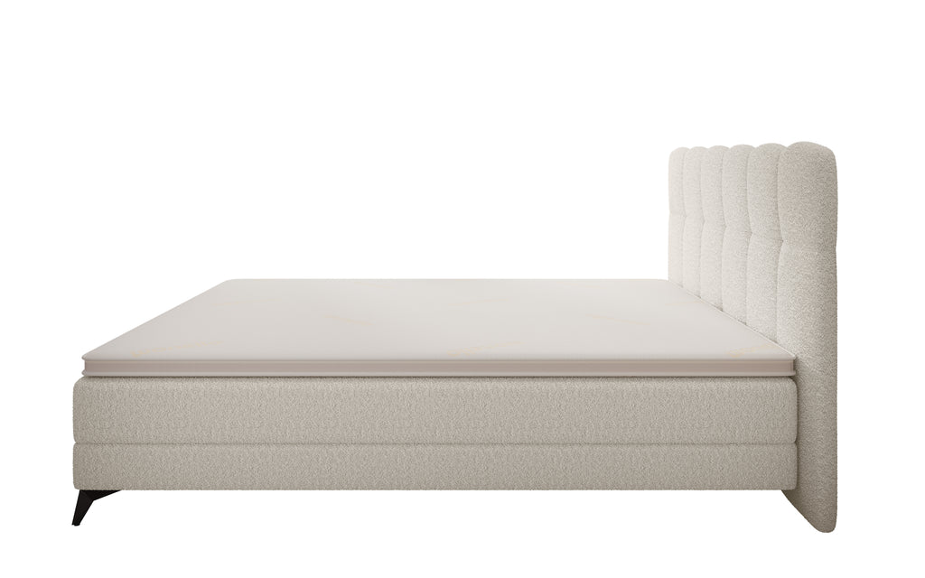 Productfoto met zijaanzicht. Cremekleurig bed.